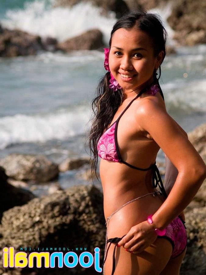 15P Joon Mali is a cute thai chick in a bikini by the rocks