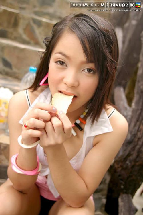 15P Cute asian teen posing outside