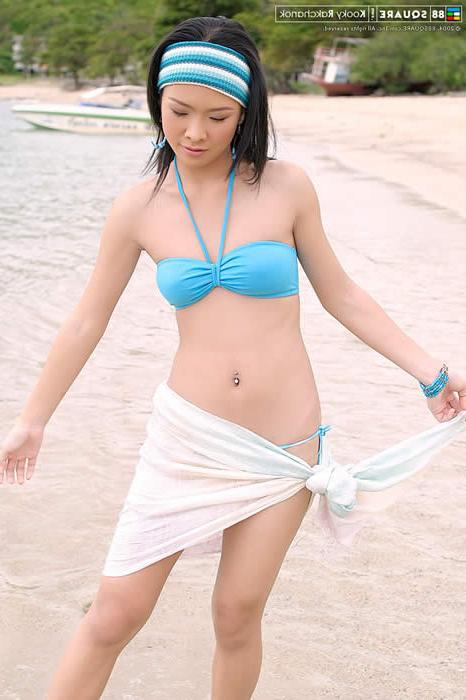 15P Cute asian girl posing on the beach