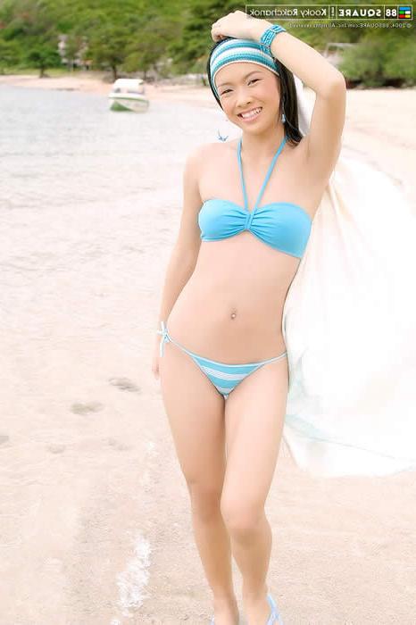 15P Cute asian girl posing on the beach