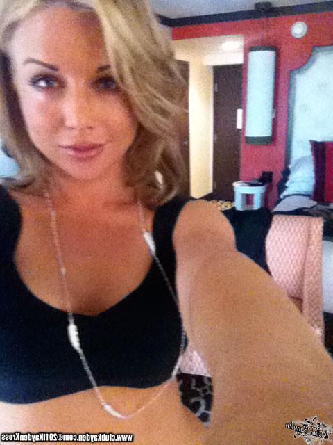 15P Kayden Kross playing with her phone camera at home