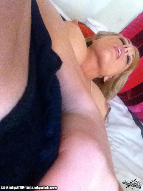15P Kayden Kross playing with her phone camera at home