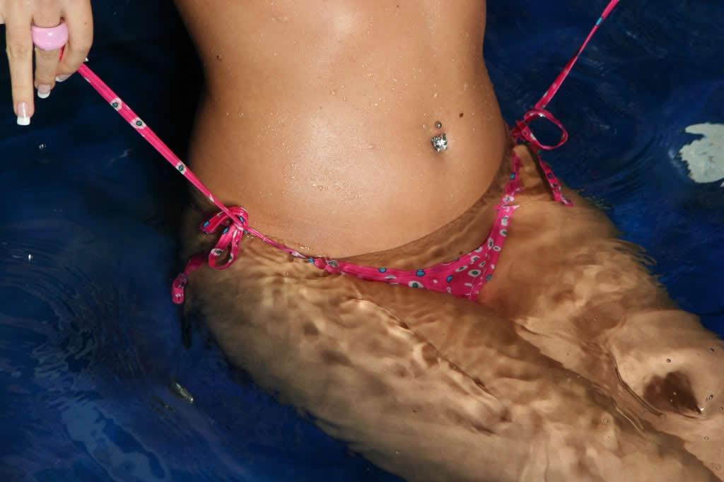 18P Cute blonde teen takes off her bikini in a jacuzzi