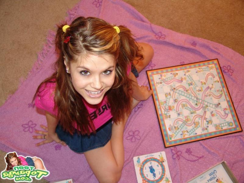 16P Sexy Teen With Braces Playing A Board Game