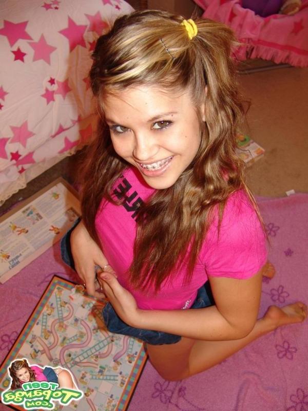 16P Sexy Teen With Braces Playing A Board Game