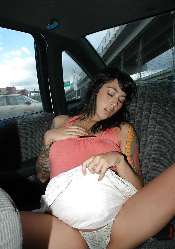16P busty pregnant brunette posing in the car