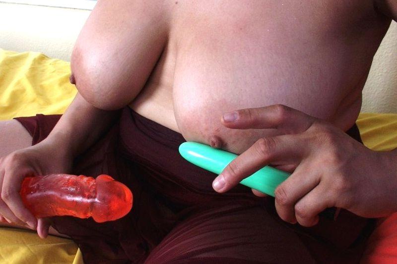 16P Big titted chubby chick shows shaved pussy and plays with dildos