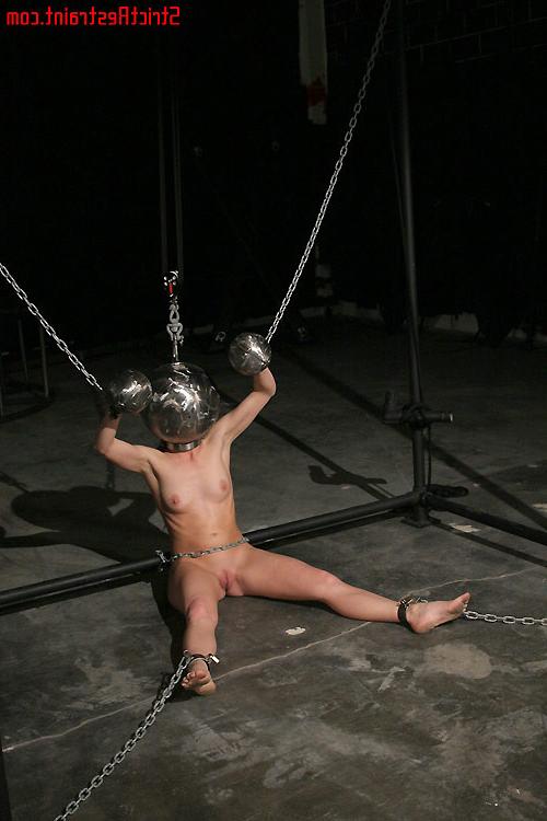 15P Chained and cuffed to the rack Ariel X awaits her Masters touch