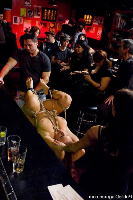 15P Slave Bella Rossi gets banged by John Strong in a public bar