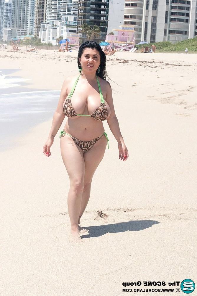 15P Busty latina milf posing in bikini on beach