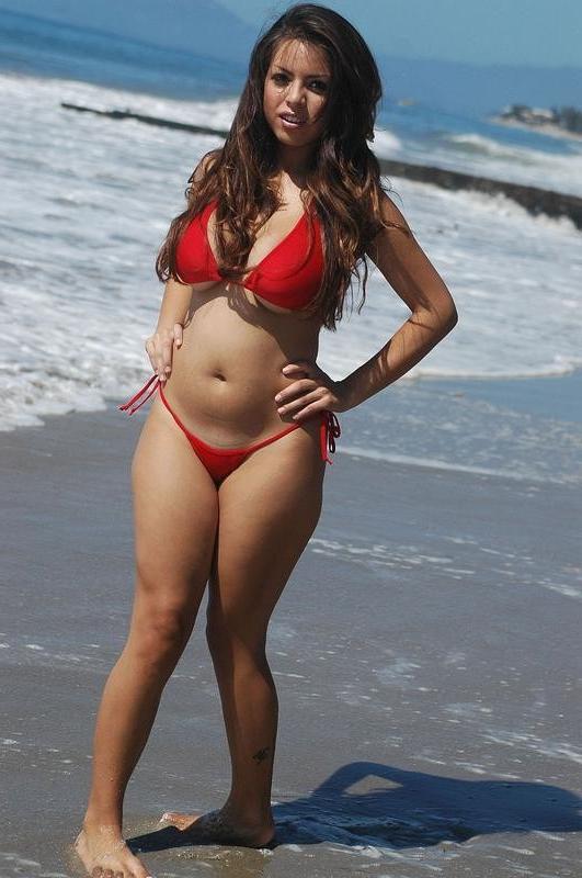 15P Yurizan Beltran strips off her red bikini down at the beach