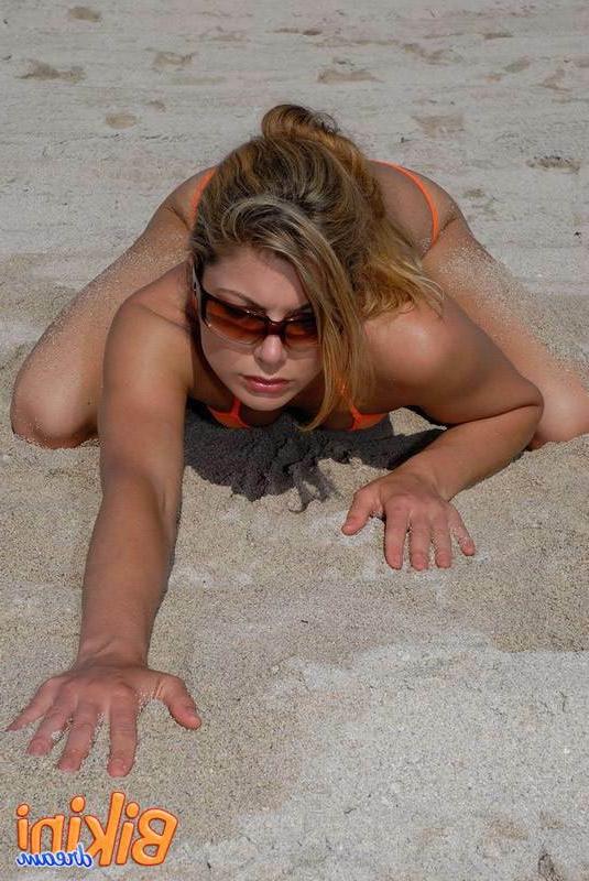 15P Babe in a tiny thong bikini at the beach