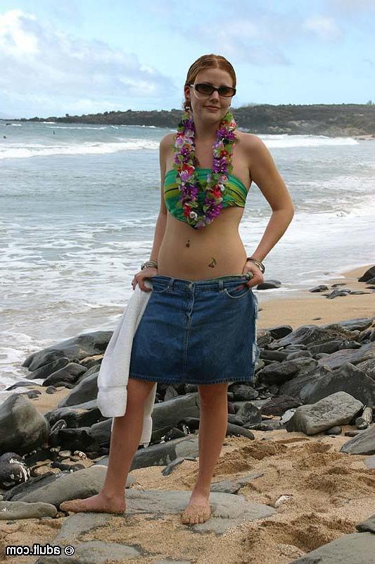16P Sexy bikini girl gets naked on the beach and spreads her legs