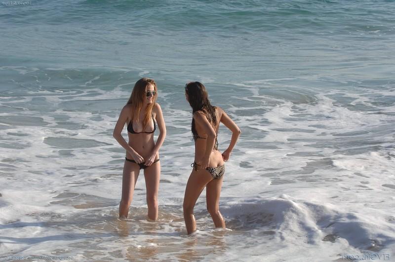 16P Two Bikini Babes Playing On the Beach