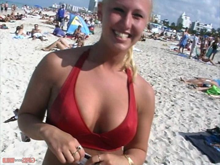 10P Blonde bikini beach babe shows her huge juggs