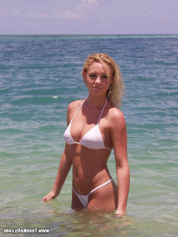 15P Cute innocent blonde teen on the beach in a bikini