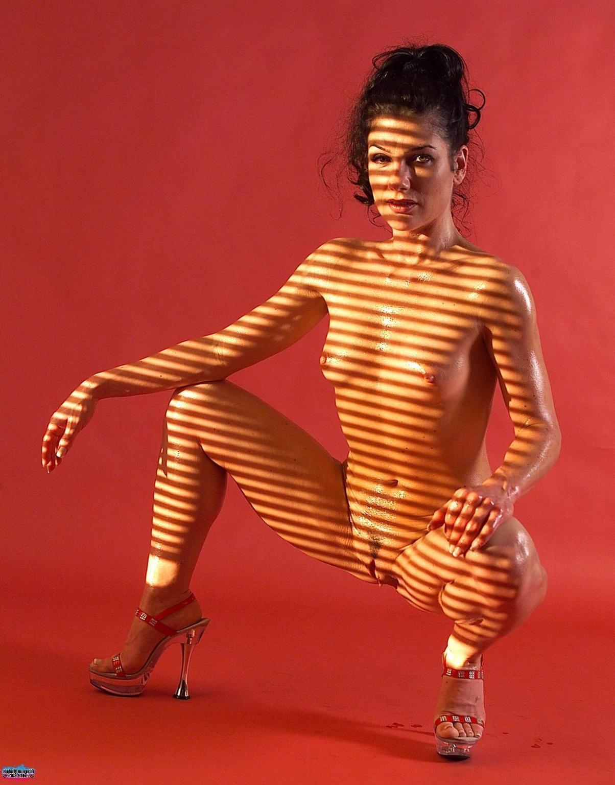 16P Sexy brunette posing nude in the red room 