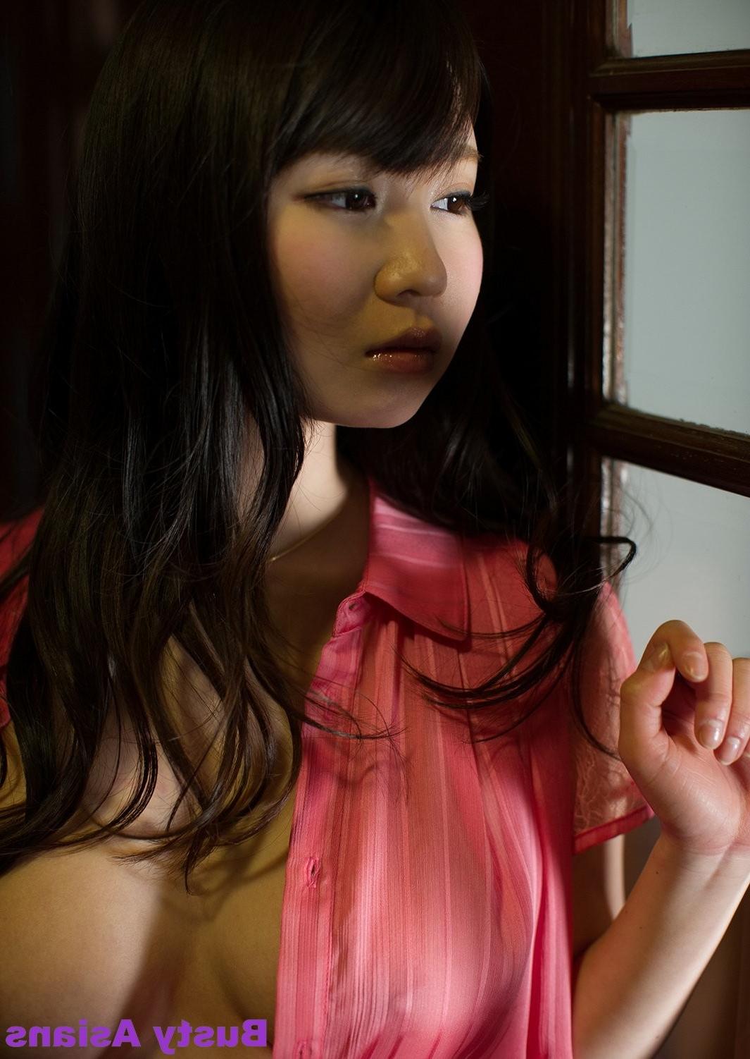 15P Busty asian Aika Yumeno posing in the living room her natural big tits