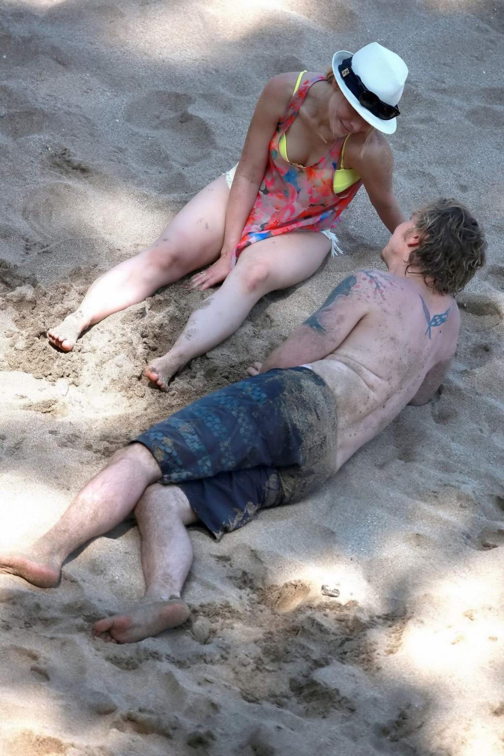 16P Kristen Bell showing off her yellow bikini ass at the beach in Hawaii