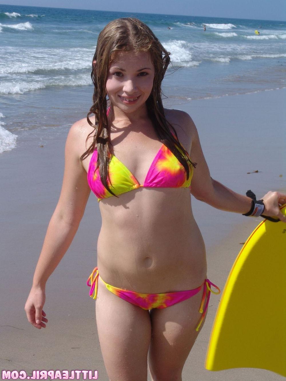 16P Pretty teen surfer in sexy bikini teases perky tits and pussy in a car