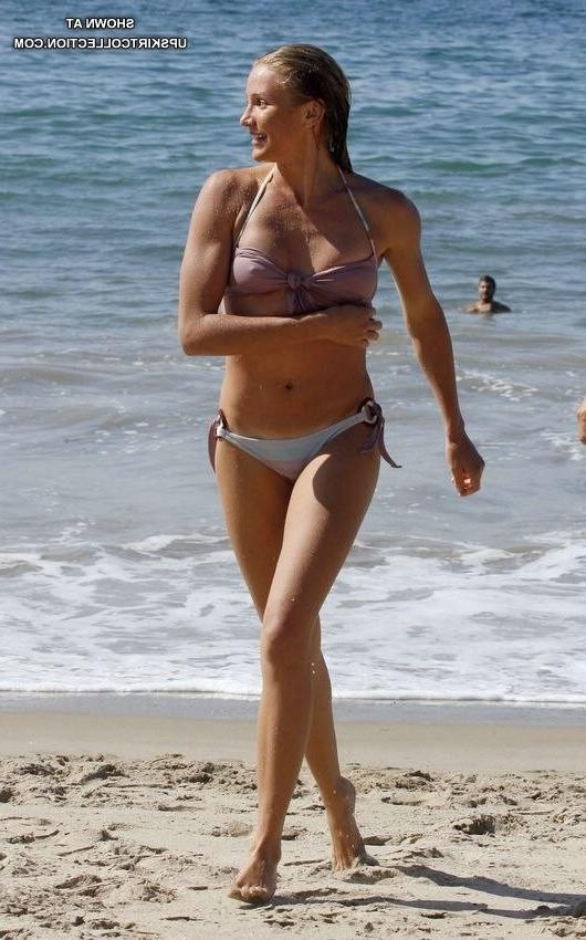 15P Female in white bikini relaxing in the water