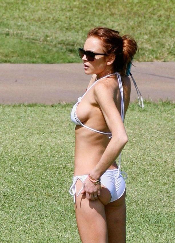 16P Lindsay Lohans big round boobs almost spill out of bikini