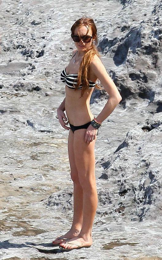 16P Lindsay Lohans big round boobs almost spill out of bikini