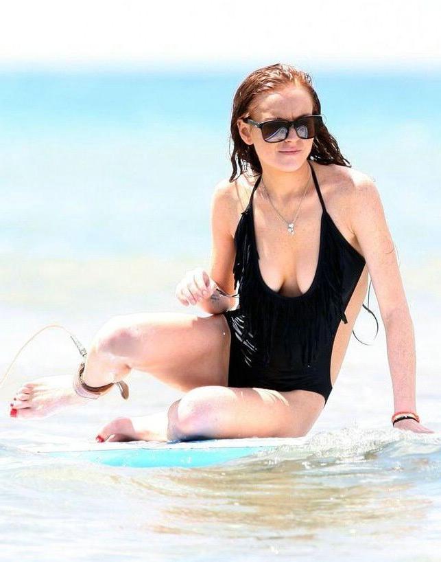 16P Lindsay Lohans big round boobs almost spill out of bikini