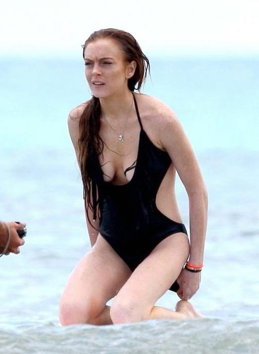16P Lindsay Lohans big round boobs almost spill out of bikini