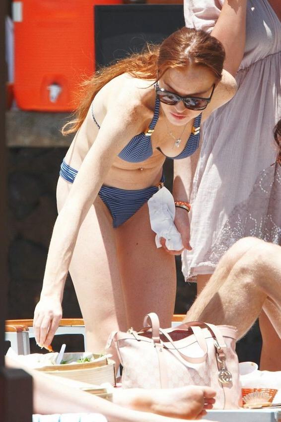 16P Lindsay Lohans big round boobs almost spill out of bikini