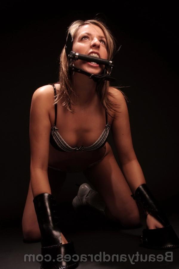 16P Blonde teen with braces and a horse muzzle in her mouth