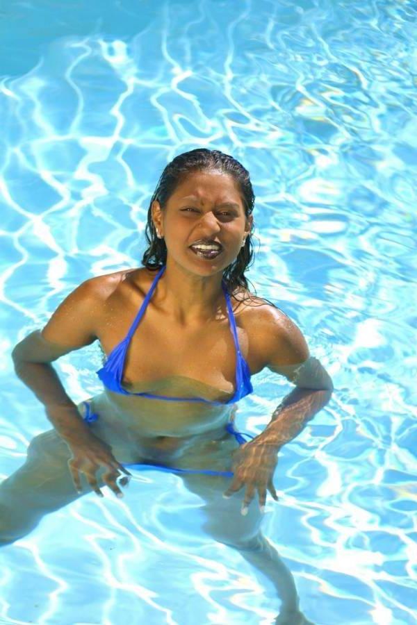 16P Sexy Indian girl in a thong bikini at the pool