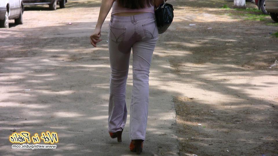 16P Brunette wets her pants and flashes ass while changing on the street