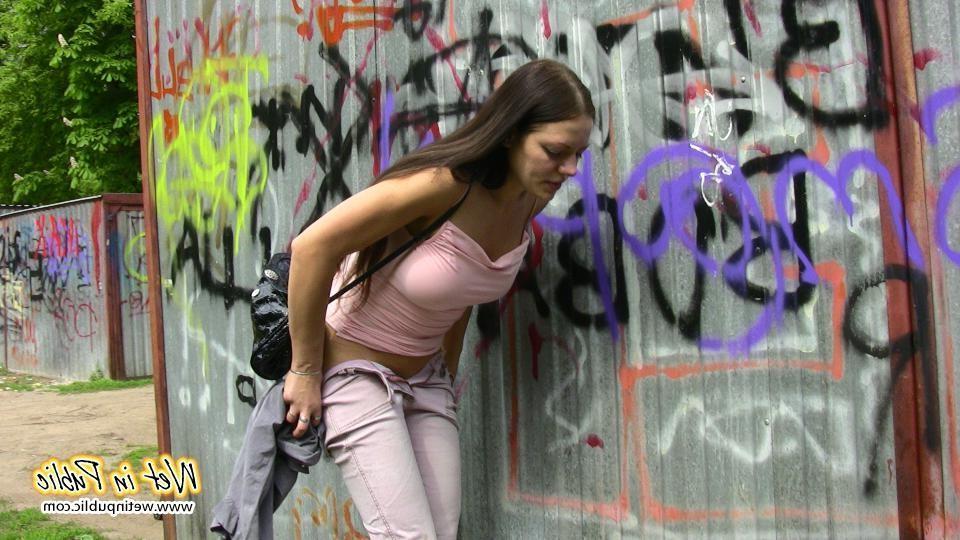 16P Brunette wets her pants and flashes ass while changing on the street