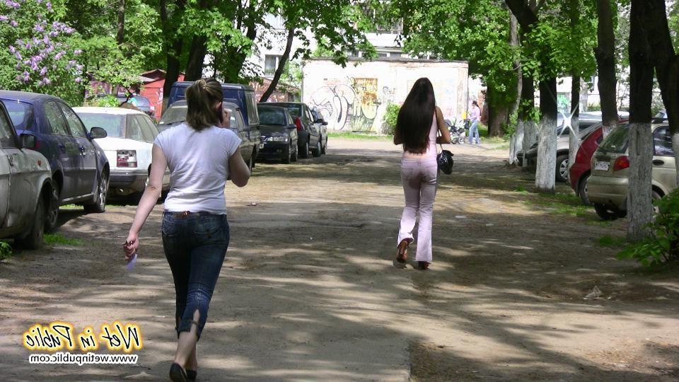 16P Brunette wets her pants and flashes ass while changing on the street