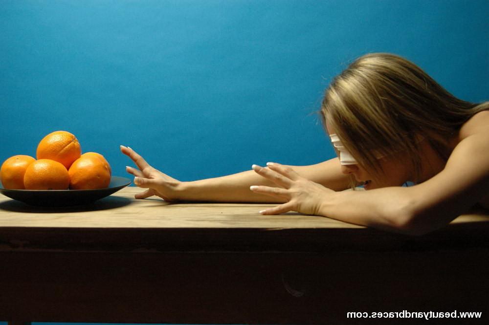 16P Blonde teen with braces makes a mess devouring an orange