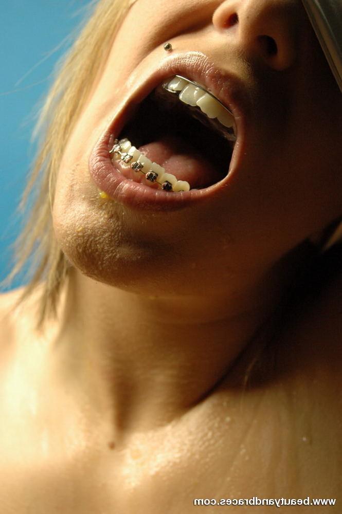 16P Blonde teen with braces makes a mess devouring an orange