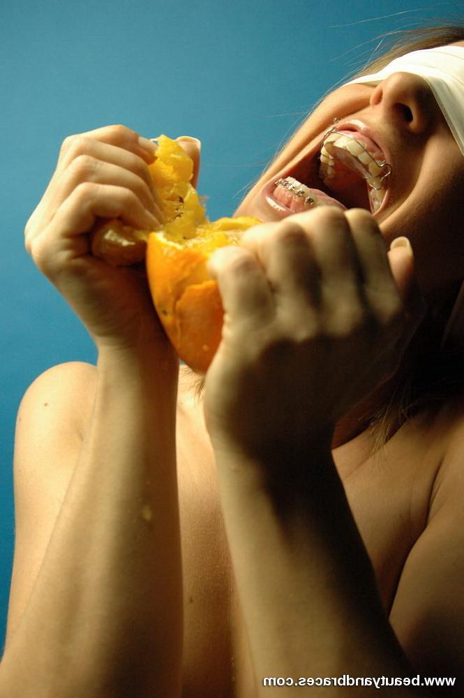 16P Blonde teen with braces makes a mess devouring an orange