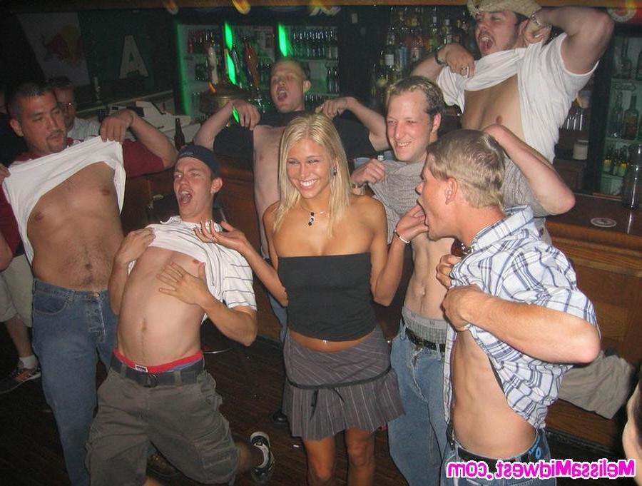 15P Melissa Midwest posing inside a bar drunk