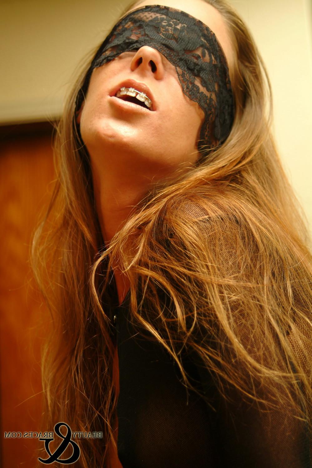 16P Brunette teen with braces strips out of a body stocking