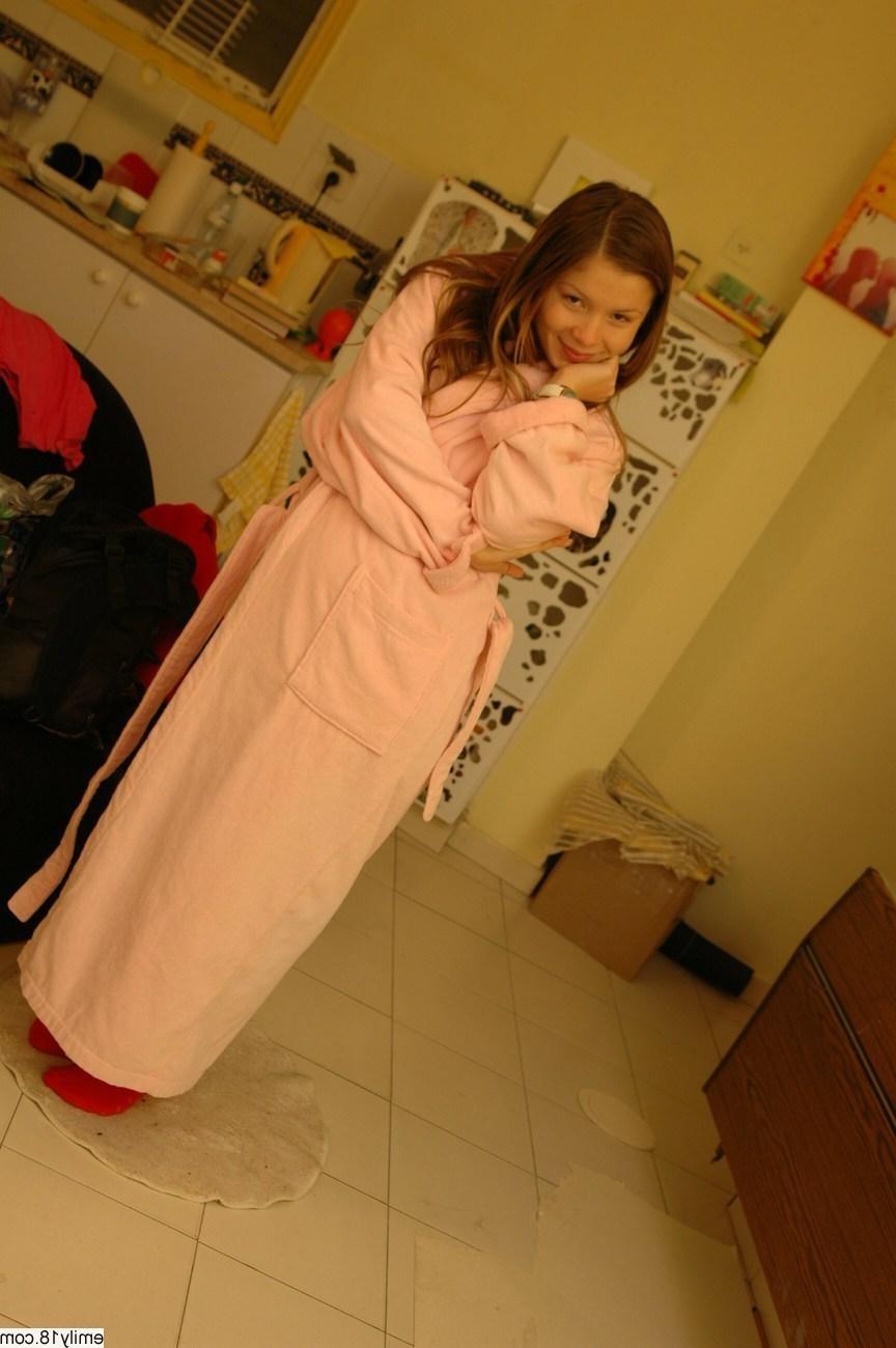 16P Pretty brunette teen girl removes bathrobe