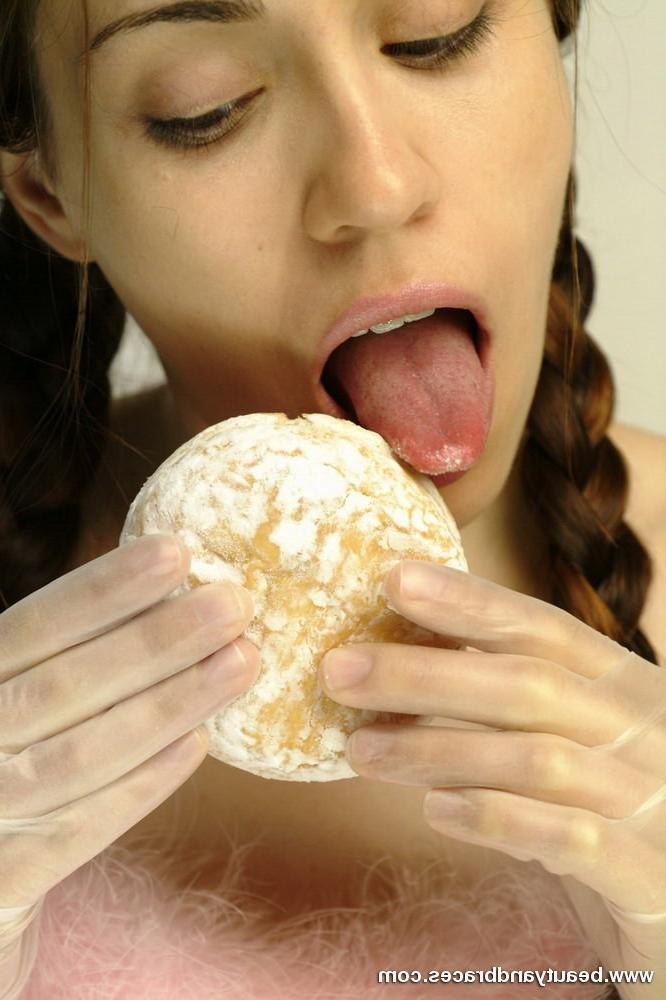 16P Pigtailed teen with braces stuffs a donut in her sexy mouth