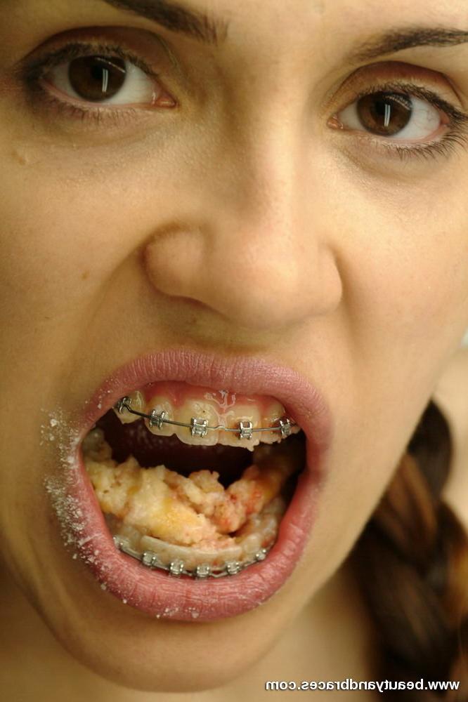 16P Pigtailed teen with braces stuffs a donut in her sexy mouth