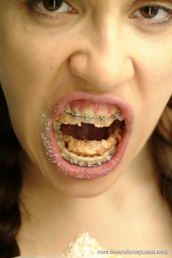 16P Pigtailed teen with braces stuffs a donut in her sexy mouth