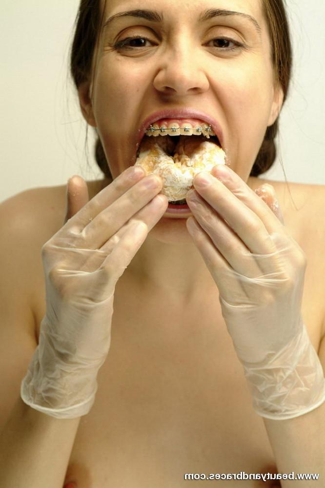 16P Pigtailed teen with braces stuffs a donut in her sexy mouth