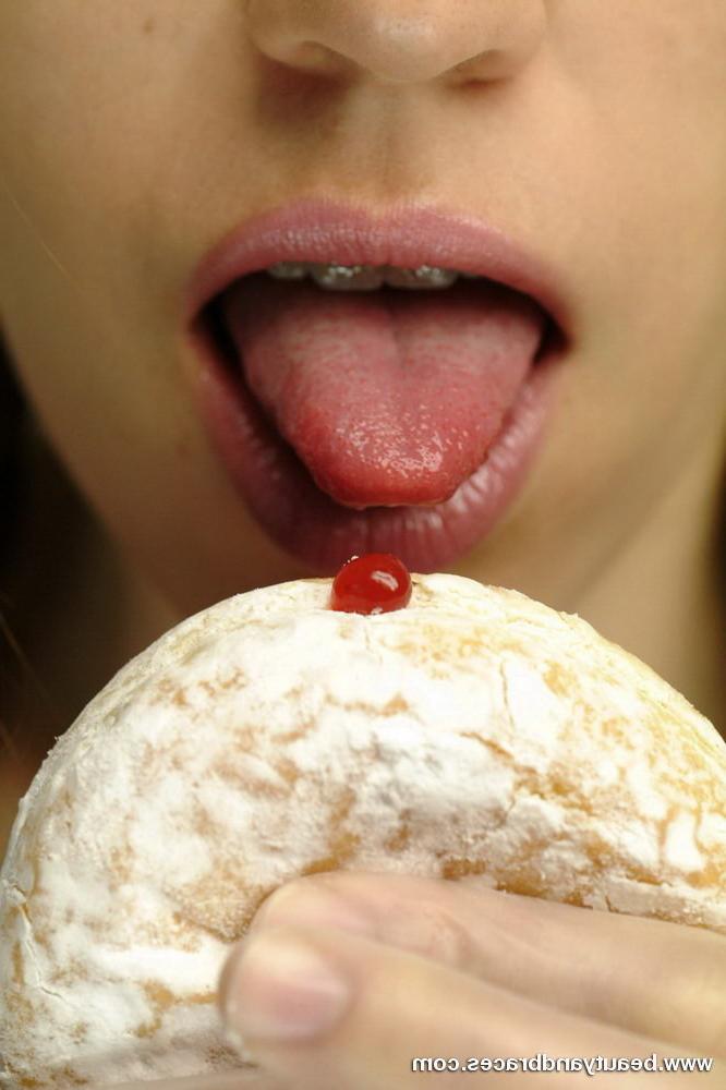16P Pigtailed teen with braces stuffs a donut in her sexy mouth
