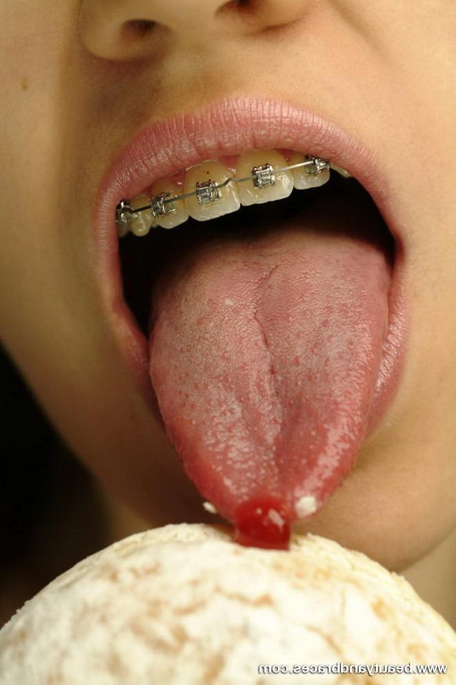 16P Pigtailed teen with braces stuffs a donut in her sexy mouth