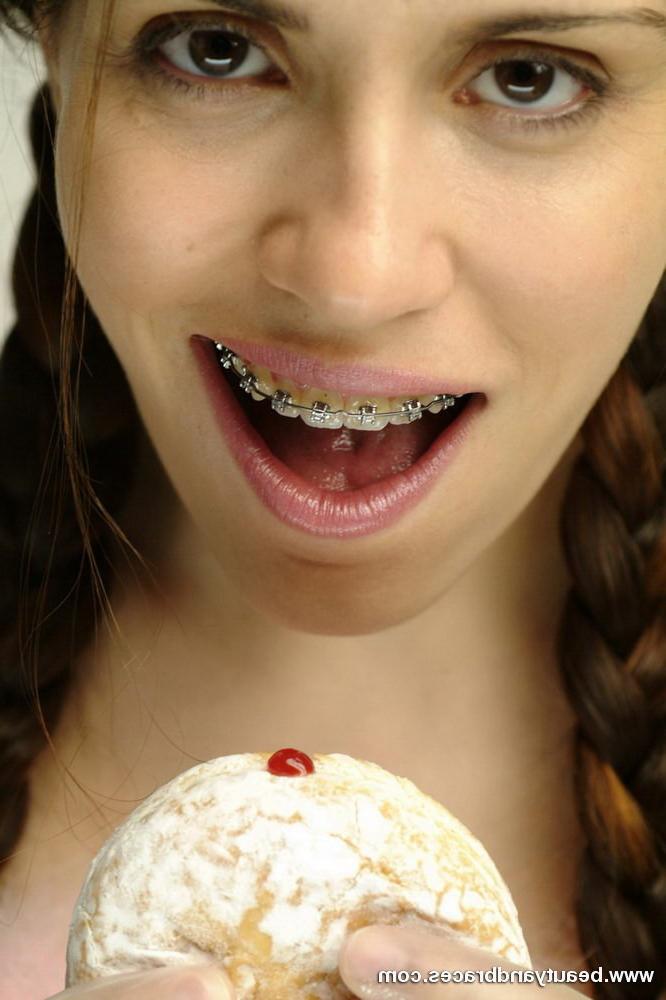 16P Pigtailed teen with braces stuffs a donut in her sexy mouth