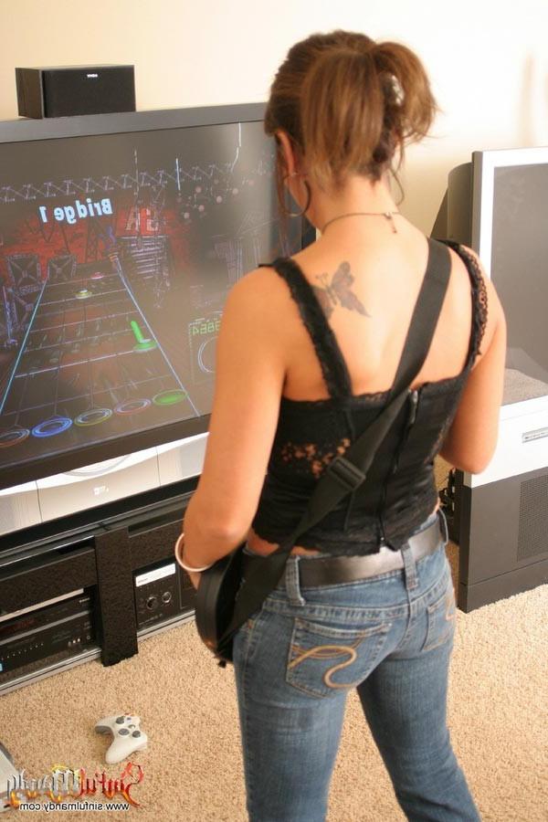 16P Busty brunette girl plays guitar hero