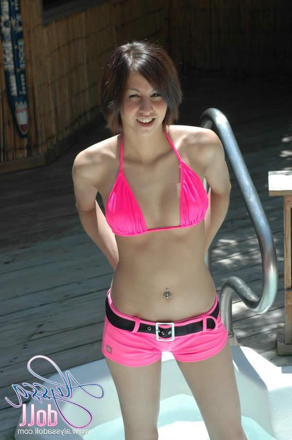 15P Brunette teen splashes and strips in the hottub